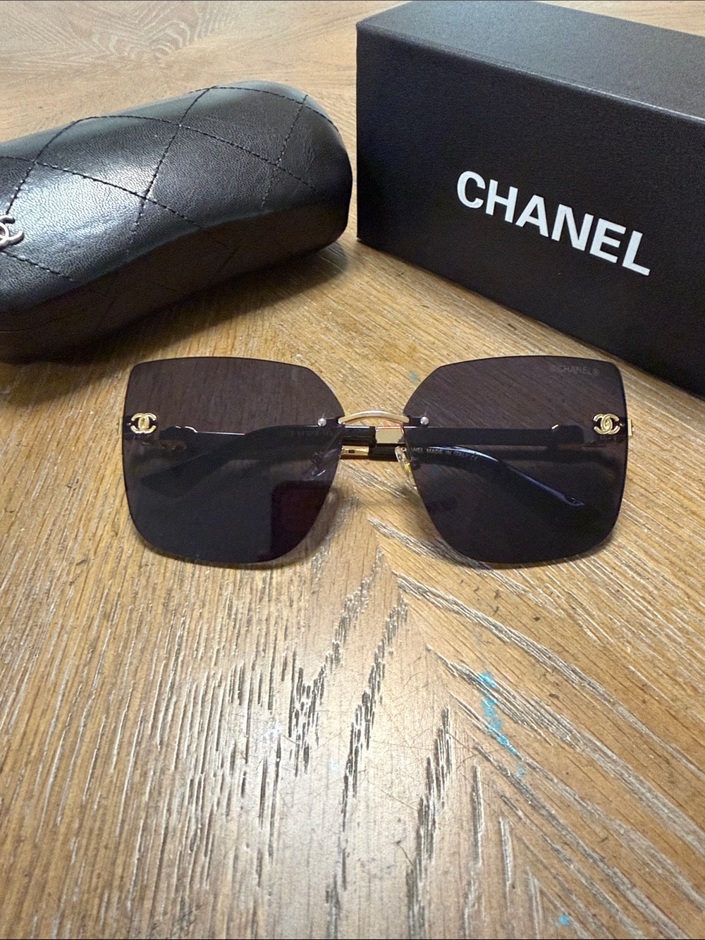 CHANEL Rimless Square Sunglasses in Dark Gradient with Gold Accents